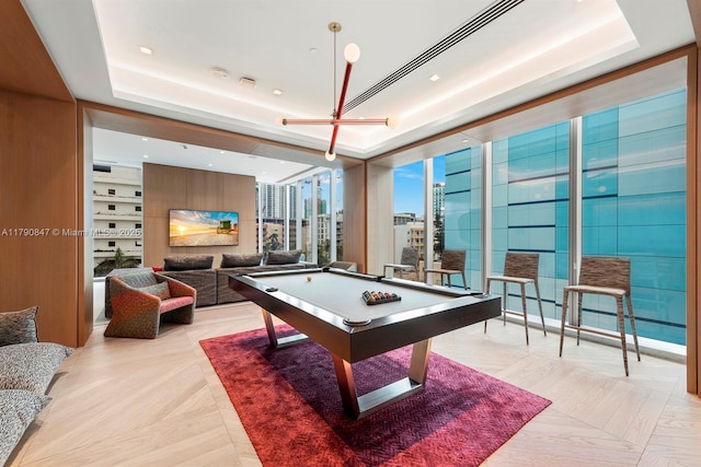 playroom featuring billiards and a tray ceiling