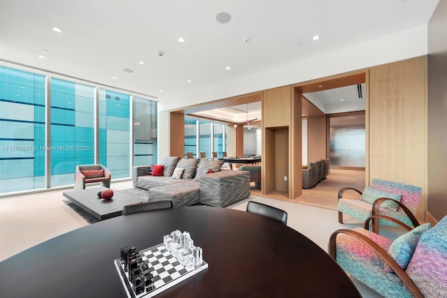 dining area featuring recessed lighting, floor to ceiling windows, and light colored carpet