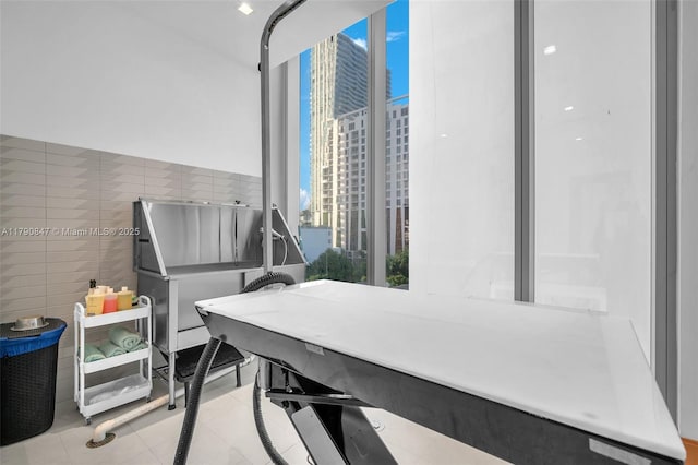 700 NE 26th Ter Unit Th-403, Miami, FL 33137 - office area with tile walls and light tile patterned floors
