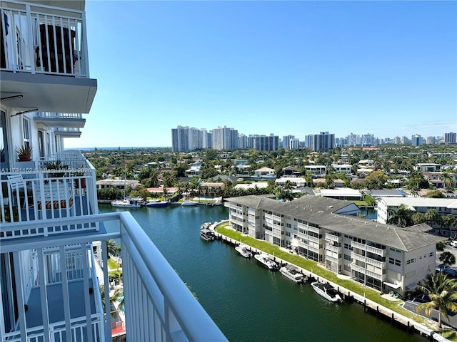 balcony with a view of city and a water view