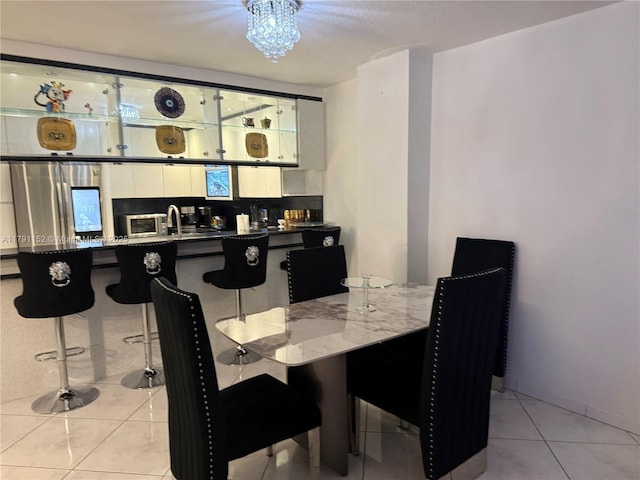 dining room with light tile patterned floors and bar