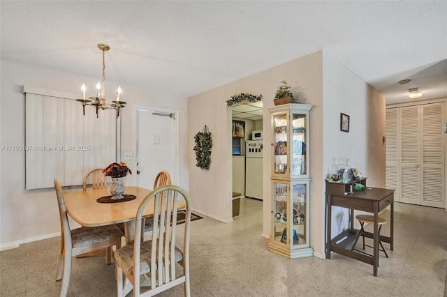700 Layne Blvd Unit 218, Hallandale Beach, FL 33009 - dining area with a notable chandelier and baseboards