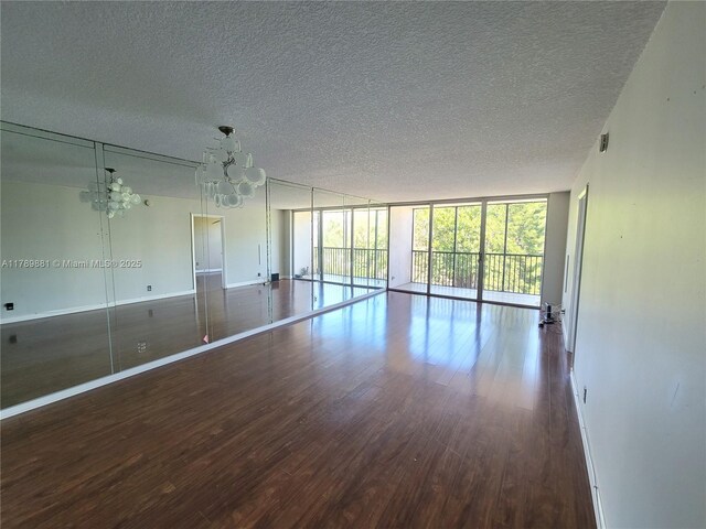 7080 Environ Blvd Unit 424, Lauderhill, FL 33319 - unfurnished room with a textured ceiling, wood finished floors, and baseboards
