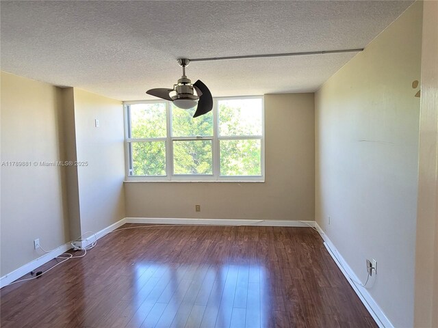 7080 Environ Blvd Unit 424, Lauderhill, FL 33319 - empty room featuring a wealth of natural light, wood finished floors, a ceiling fan, and a textured ceiling