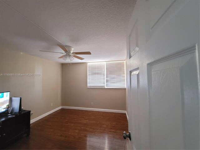7080 Environ Blvd Unit 424, Lauderhill, FL 33319 - empty room with baseboards, wood finished floors, and ceiling fan
