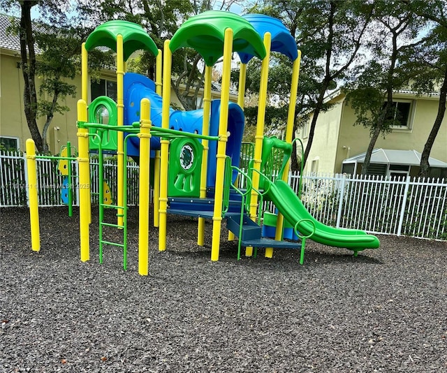 community jungle gym featuring fence