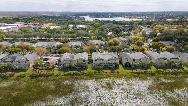 bird's eye view featuring a residential view and a water view