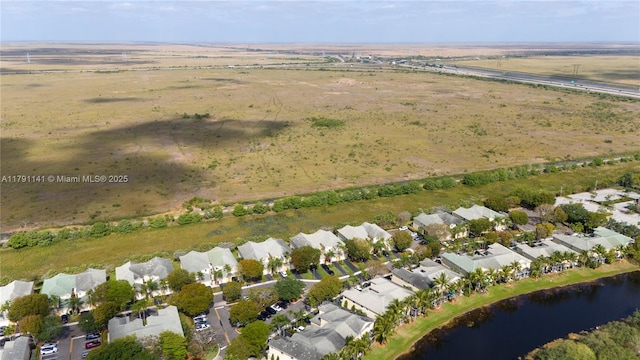 aerial view with a water view and a residential view