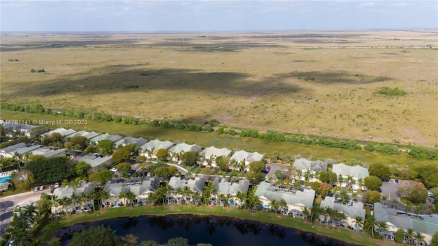 birds eye view of property with a water view and a residential view