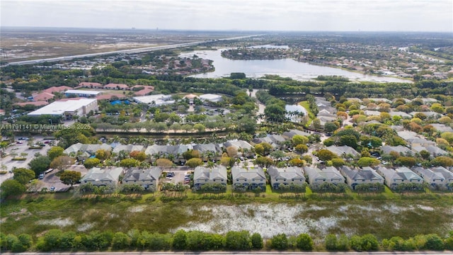 birds eye view of property featuring a residential view and a water view