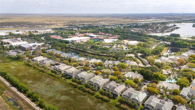 drone / aerial view featuring a residential view and a water view