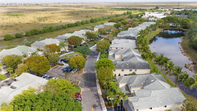 birds eye view of property featuring a residential view and a water view