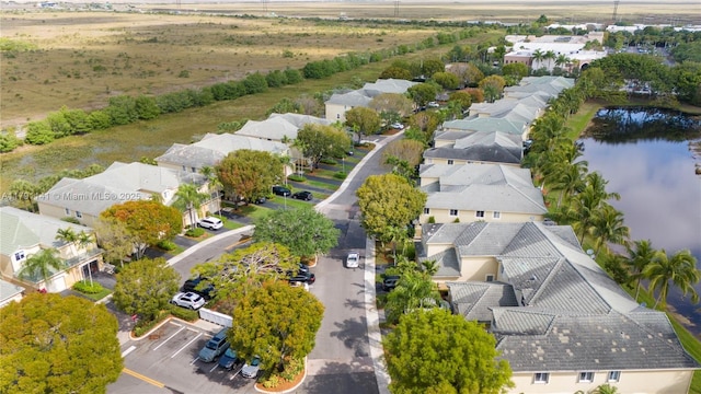 bird's eye view with a water view and a residential view