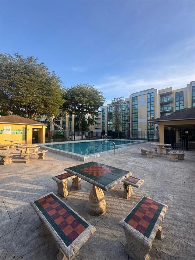 11750 SW 18th St Unit 406-1, Miami, FL 33175 - community pool featuring a patio area