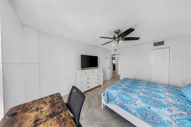 bedroom with visible vents, ceiling fan, and baseboards