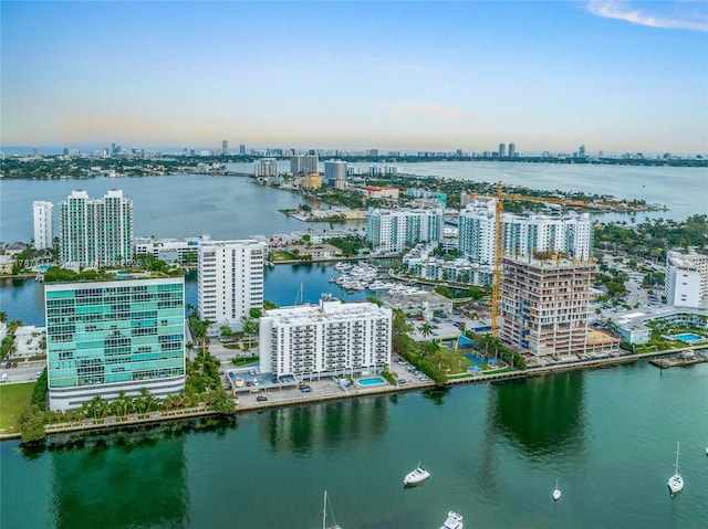 bird's eye view featuring a view of city and a water view