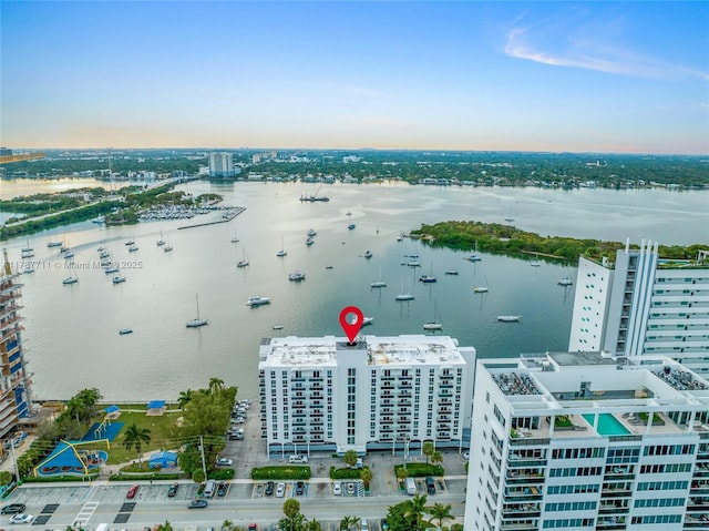 birds eye view of property featuring a water view