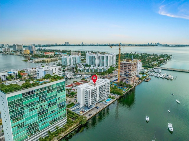 bird's eye view featuring a view of city and a water view