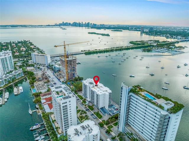 bird's eye view featuring a view of city and a water view