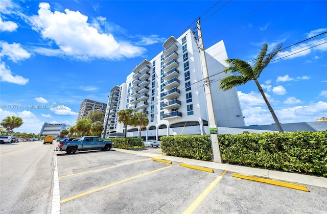 view of property with uncovered parking