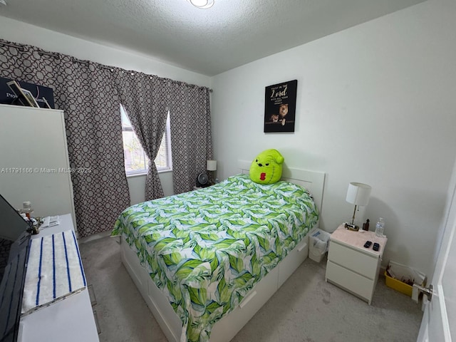 carpeted bedroom with a textured ceiling