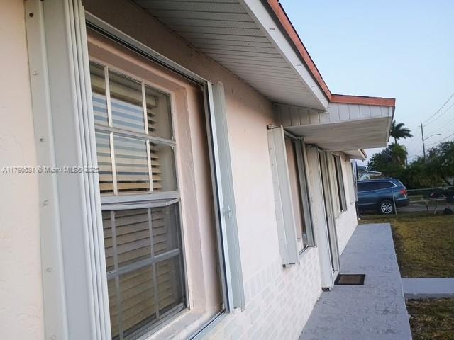 view of side of property featuring stucco siding