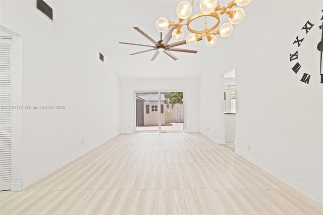 18982 Cloud Lake Cir, Boca Raton, FL 33496 - unfurnished living room featuring baseboards, vaulted ceiling, and a chandelier