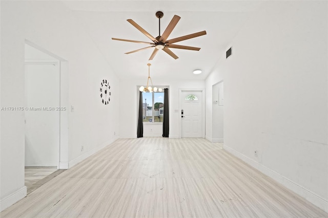 18982 Cloud Lake Cir, Boca Raton, FL 33496 - unfurnished living room with vaulted ceiling, baseboards, ceiling fan with notable chandelier, and visible vents