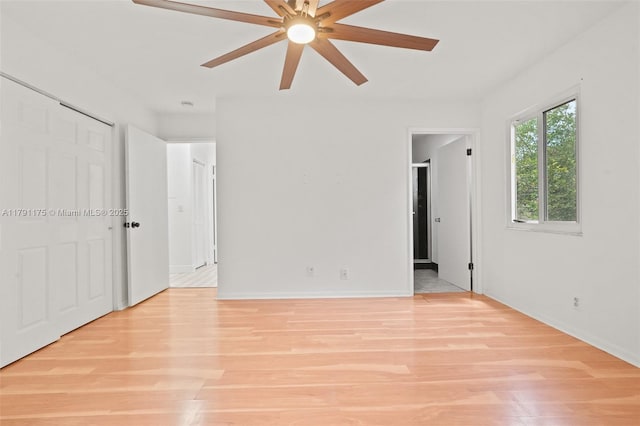 18982 Cloud Lake Cir, Boca Raton, FL 33496 - empty room featuring a ceiling fan, baseboards, and light wood-type flooring
