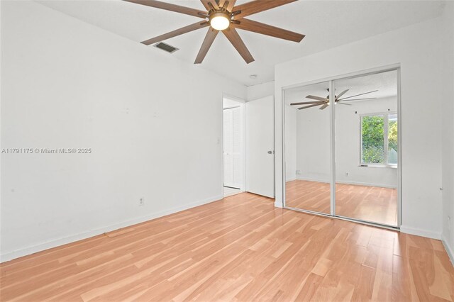 18982 Cloud Lake Cir, Boca Raton, FL 33496 - unfurnished bedroom with baseboards, a ceiling fan, light wood-style flooring, and visible vents