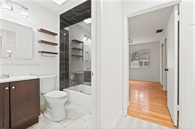 18982 Cloud Lake Cir, Boca Raton, FL 33496 - bathroom featuring toilet, baseboards, tub / shower combination, and vanity