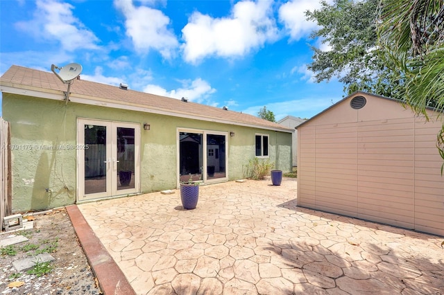 18982 Cloud Lake Cir, Boca Raton, FL 33496 - back of property with a patio, an outbuilding, stucco siding, and french doors