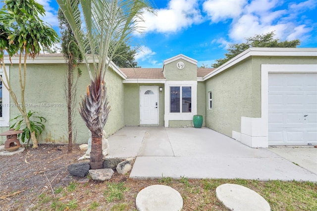 18982 Cloud Lake Cir, Boca Raton, FL 33496 - view of front of home featuring a garage and stucco siding