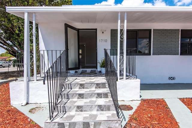 1710 E 6th Ave, Hialeah, FL 33010 - entrance to property with covered porch and stucco siding