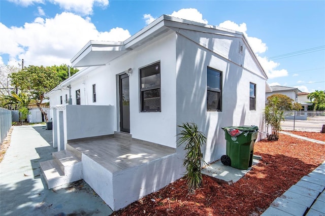 1710 E 6th Ave, Hialeah, FL 33010 - view of property exterior featuring fence and stucco siding