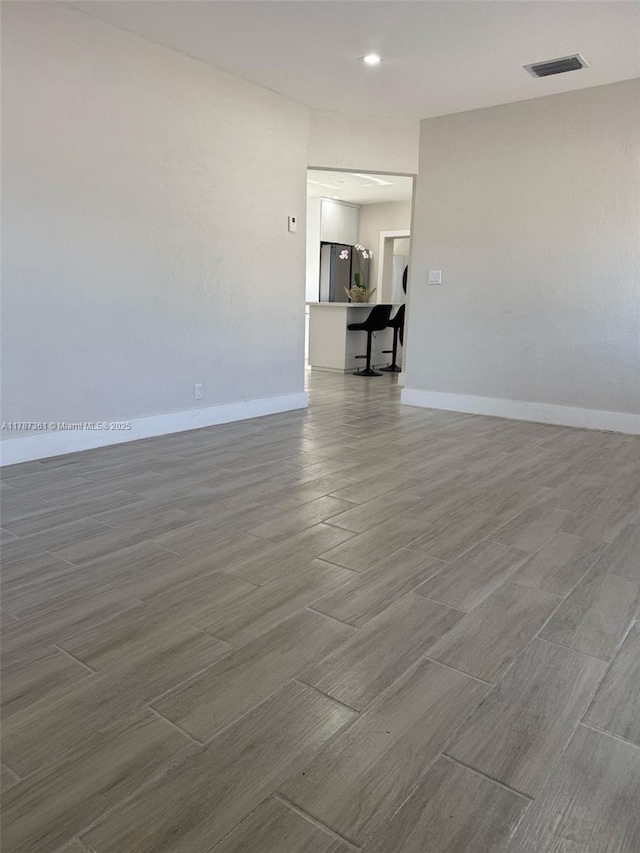 1710 E 6th Ave, Hialeah, FL 33010 - empty room featuring wood finished floors and baseboards
