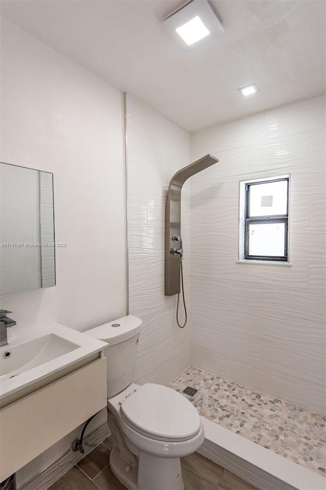 1710 E 6th Ave, Hialeah, FL 33010 - full bathroom featuring a tile shower, toilet, and vanity