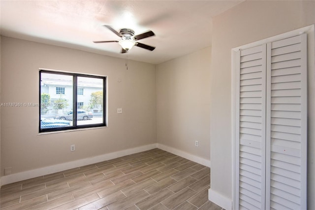 1710 E 6th Ave, Hialeah, FL 33010 - unfurnished bedroom with baseboards, wood finished floors, and ceiling fan