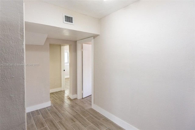 1710 E 6th Ave, Hialeah, FL 33010 - unfurnished room with baseboards and wood finished floors
