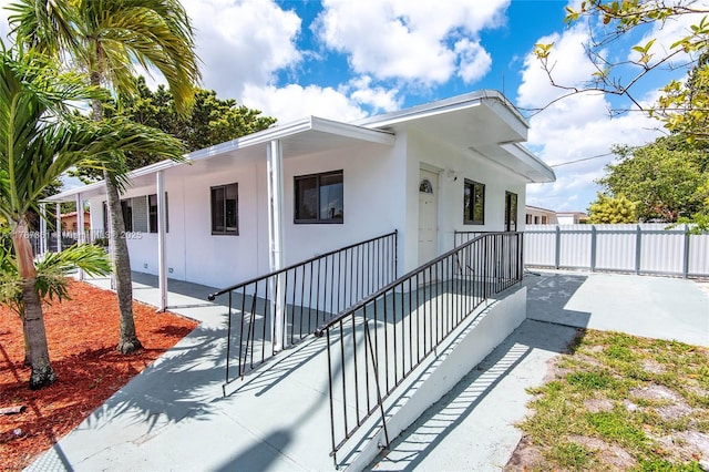 1710 E 6th Ave, Hialeah, FL 33010 - view of front facade featuring fence and stucco siding