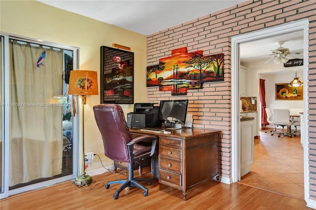 office space featuring wood finished floors and ceiling fan