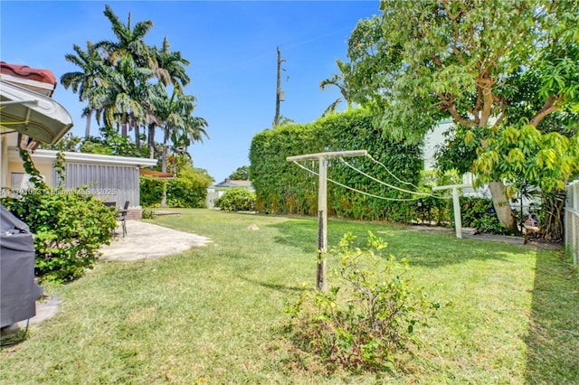 view of yard with a patio area and a fenced backyard