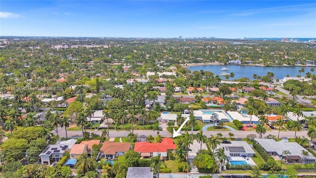 birds eye view of property with a residential view and a water view