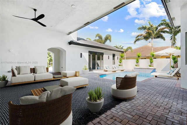 499 SW Squire Johns Ln, Palm City, FL 34990 - view of patio / terrace featuring an outdoor living space and a ceiling fan