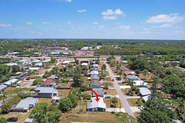 birds eye view of property with a residential view