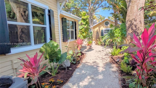 550 SW 13th Ave, Fort Lauderdale, FL 33312 - view of side of property with central AC unit and a patio area