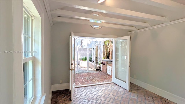550 SW 13th Ave, Fort Lauderdale, FL 33312 - foyer with baseboards, french doors, brick patterned flooring, and beam ceiling