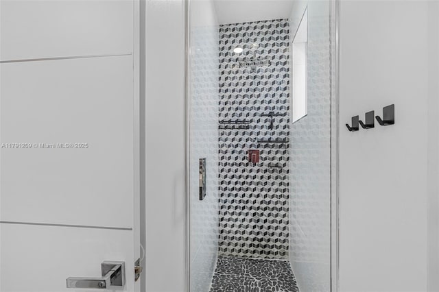 full bathroom featuring a shower stall