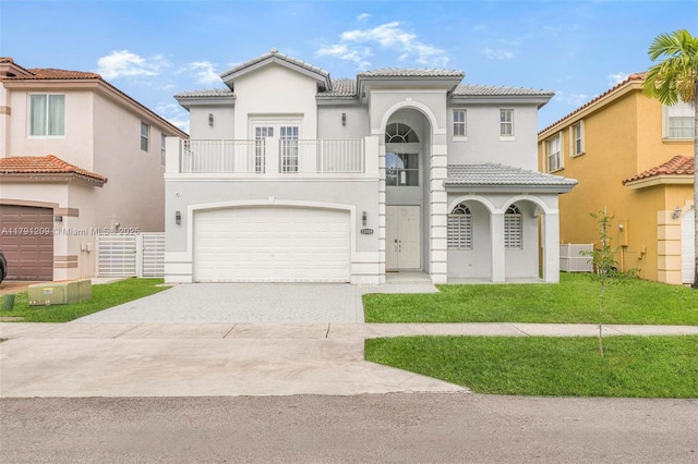 mediterranean / spanish-style home with a tiled roof, driveway, fence, a balcony, and stucco siding
