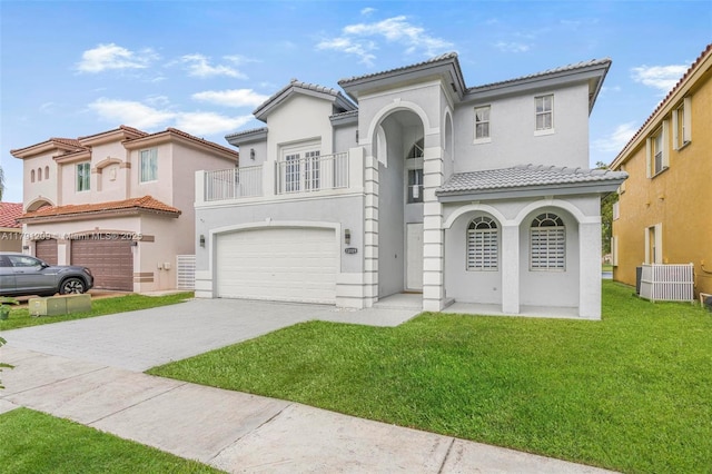 mediterranean / spanish home featuring an attached garage, stucco siding, a balcony, and a tiled roof